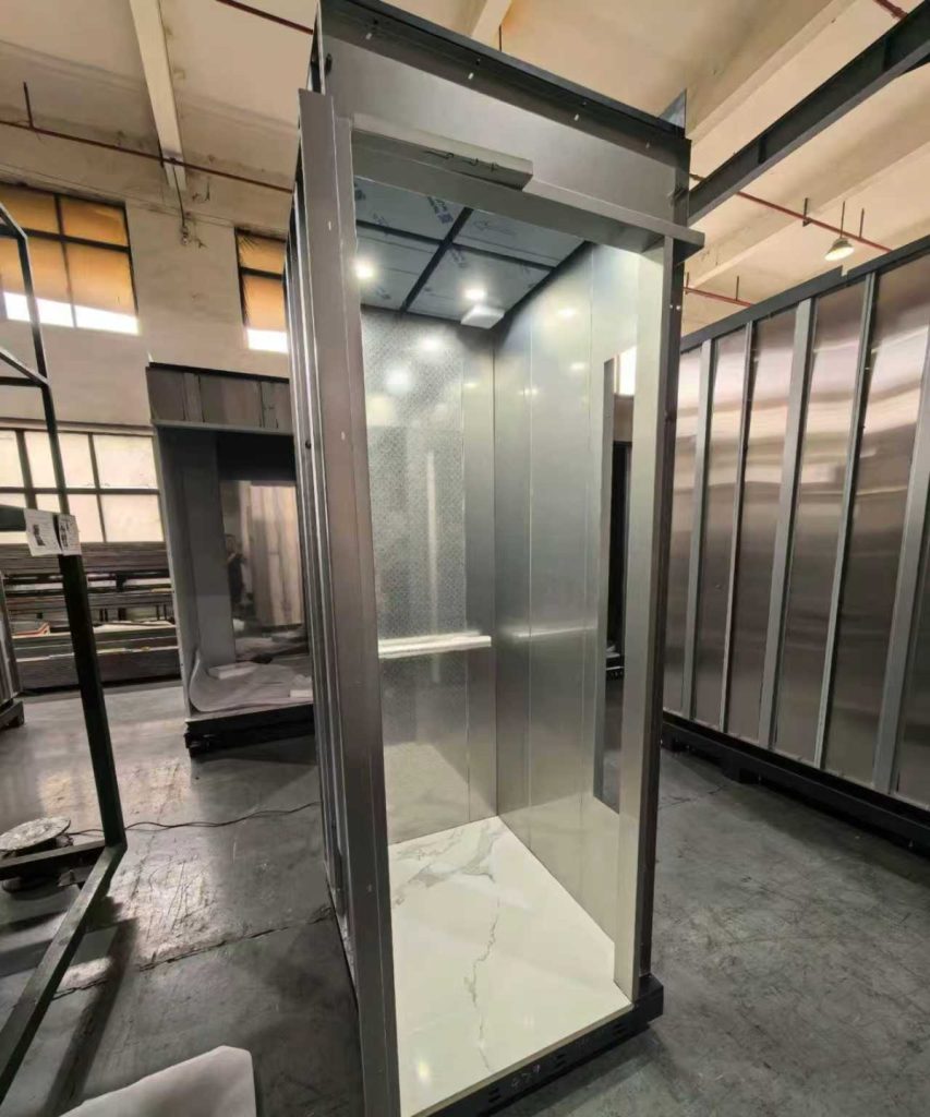 Mirror-finish Nexco elevator cabin with marble flooring